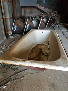 The bathtubs in the hallway of the abandoned Hotel Belvedere Dubrovnik, photo by Benjamin Martin