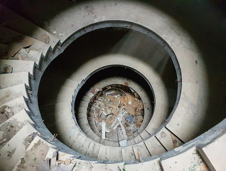 Circular staircase with a debris in the abandoned Belvedere Hotel Dubrovnik, Croatia, photo by Benjamin Martin
