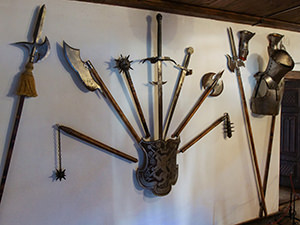 Cold weaponry displayed on the wall of Bran Castle, also known as Dracula Castle, in Transylvania, Romania, photo by Ivan Kralj