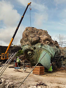 Garuda's head at the working site, several times bigger than the human worker, when assembled at GWK Cultural Park in Bali, Indonesia, this will be one of the largest sculptures in the world