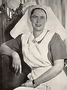 Black and white photograph of Princess Ileana, dressed as a nurse, in the Bran Castle, also known as Dracula Castle, that served as a Hospital of the Queen's Heart during and after the Second World War, in Transylvania, Romania