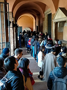 People queuing for Bocca della Verita, Mouth of Truth, to take a picture with a scuplture that supposedly bites off the liar's hand, Basilica of Santa Maria in Cosmedin, Rome, Italy, photo by Ivan Kralj