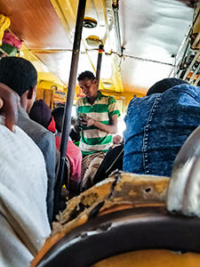 Bus conductor selling tickets in the African local bus from Bahir Dar to Tis Abay, Ethiopia, photo by Ivan Kralj