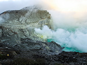 Sulfur smokes above the acidic crater lake of Kawah Ijen Volcano, East Java, Indonesia, photo by Ivan Kralj