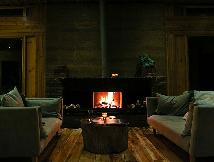 Fireplace with cozy sofas in the bar area of Limalimo Lodge at Simien Mountains, Ethiopia, photo by Ivan Kralj