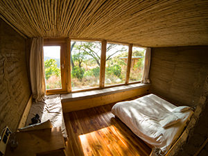 Interior of the room in Limalimo Lodge at Simien Mountains, Ethiopia, with massive windows looking into nature, photo by Ivan Kralj