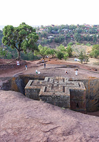 Bete Giyorgis in Lalibela, Ethiopia, rock-hewn church in the shape of the Greek cross, with pilgrims praying around the site, photo by Ivan Kralj