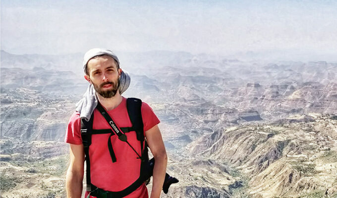 Pipeaway blogger Ivan Kralj standing in front of the landscape of Simien Mountains in Ethiopia, Africa