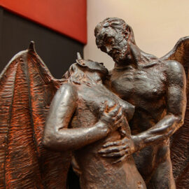 Sculpture of a winged devil holding a naked woman in his arms, displayed at Devil's Museum in Kaunas, Lithuania, photo by Ivan Kralj