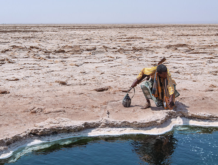 Afar man at the edge of the little lake in Danakil Depression, Ethiopia, the hottest place on Earth, photo by Ivan Kralj