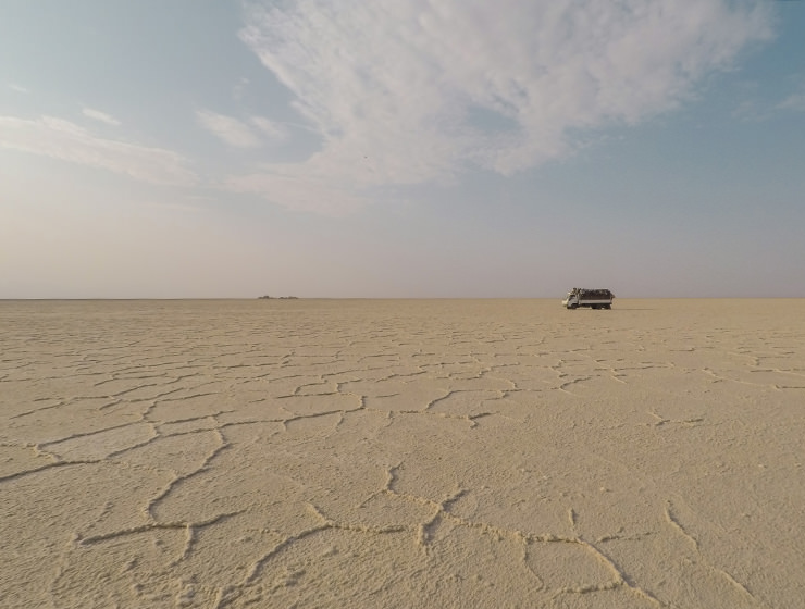 Truck with miners driving over the salt plains of Lake Assale, Danakil Depression, Ethiopia, the hottest place on Earth, photo by Ivan Kralj