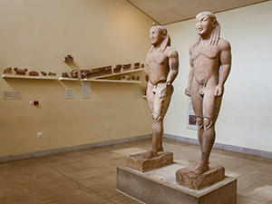 The pair of identical marble kouroi, depicting the twin brothers from Argos, Cleobis and Biton, the sculpture dates to the early 6th century BC, now kept at Delphi Archeologica Museum in Delphi, center of the world, Greece, photo by Ivan Kralj