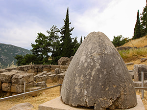 Omphalos, or religious stone marking the center of the world according to Greek mythology, dropped by the eagles sent by Zeus from west and east - they met at Delphi, Greece, photo by Ivan Kralj