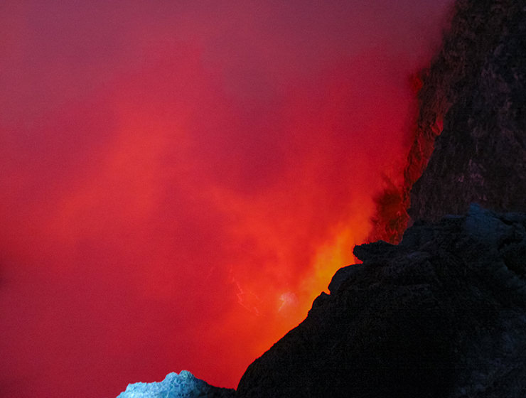 One of the world's five permanent lava lakes hiding under the cloud of smoke, at Erta Ale volcano in Danakil Depression, Ethiopia, the hottest place on Earth, photo by Ivan Kralj