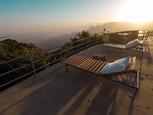 Sunbeds at the terrace of Limalimo Lodge, overviewing the misty Simien Mountains during sunrise, photo by Ivan Kralj.