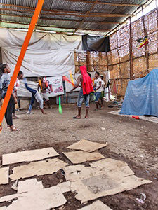 Bare earth ground covered with cardboard in the training hall of Arba Minch Circcus, the social circus group in Ethiopia, photo by Ivan Kralj