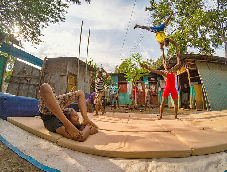 Street kids training contortion and acrobatics in the courtyard of Arba Minch Circus, social circus in Ethiopia, photo by Ivan Kralj
