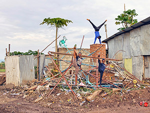One of the "Circus of Postcards" postcard: Arba Minch Circus acrobats performing on the carousel debris in Arba Minch, Ethiopia, photo by Ivan Kralj