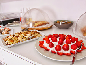 Strawberries with whipped cream and bananas with walnuts and honey at breakfast buffet in Zefi Hotel, Naoussa, Paros, Greece, photo by Ivan Kralj