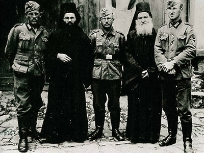 Wehrmacht soldiers and Mount Athos monks in Karyes posing together for a photograph on Easter 1941