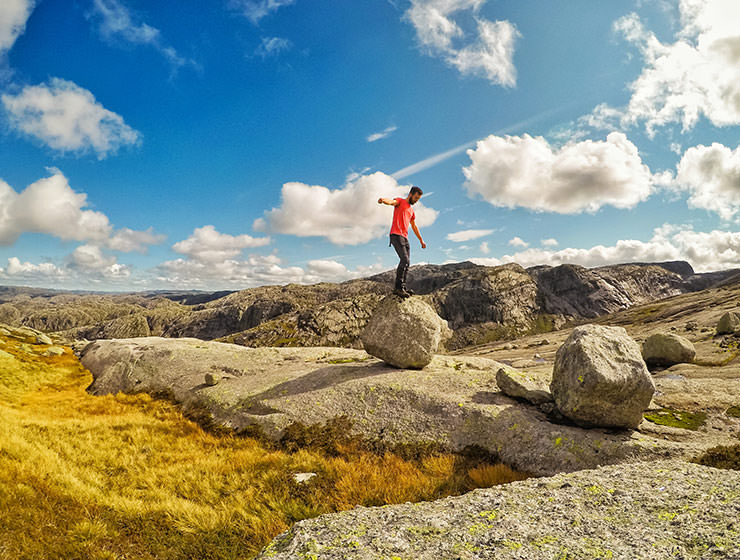 Pipeaway blogger Ivan Kralj balancing on the boulder in Kjerag mountain, Norway, photo by Ivan Kralj