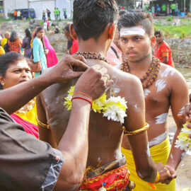 Young man having his back skin pierced with flowers at Thaipusam Festival 2019 at Batu Caves, Malaysia, photo by Ivan Kralj