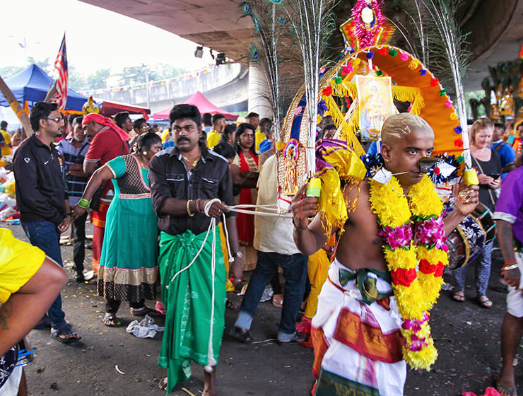 Devotee with pierced back skin being pulled by ropes at Thaipusam Festival 2019 at Batu Caves, Malaysia, photo by Ivan Kralj
