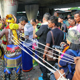 Devotee with pierced back skin being pulled by ropes at Thaipusam Festival 2019 at Batu Caves, Malaysia, photo by Ivan Kralj