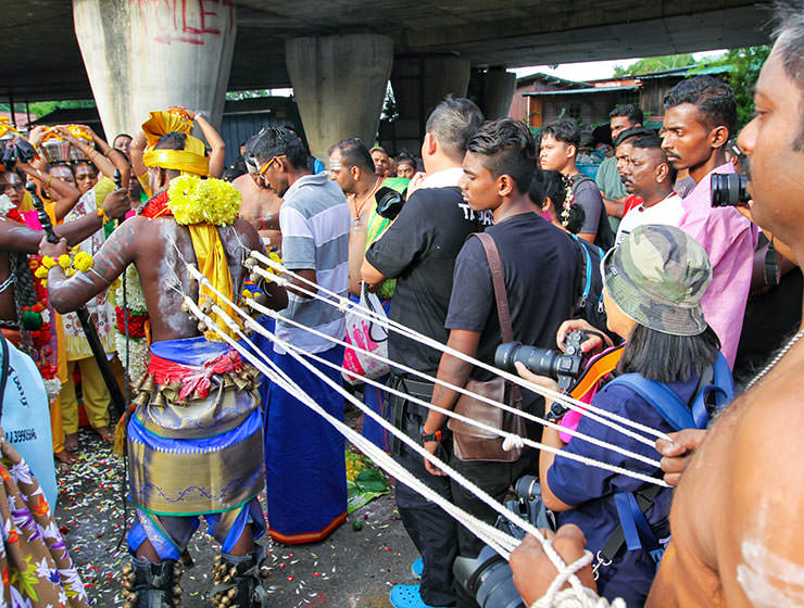 Devotee with pierced back skin being pulled by ropes at Thaipusam Festival 2019 at Batu Caves, Malaysia, photo by Ivan Kralj