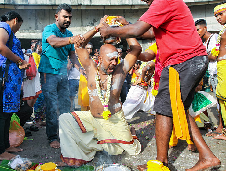 Devotee screaming while putting paal kudam milk pot on his head, at Thaipusam Festival 2019 at Batu Caves, Malaysia, photo by Ivan Kralj