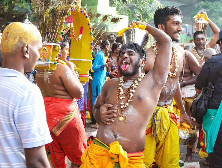 Devotee sticking his tongue out in the procession at Thaipusam Festival 2019 at Batu Caves, Malaysia, photo by Ivan Kralj