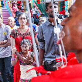 Shocked onlookers watching the pierced devotee passing by at Thaipusam Festival 2019 at Batu Caves, Malaysia, photo by Ivan Kralj