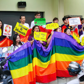 Participants posing with big rainbow flag at Chiang Mai Pride, gay parade in Chiang Mai, Thailand, photo by Ivan Kralj