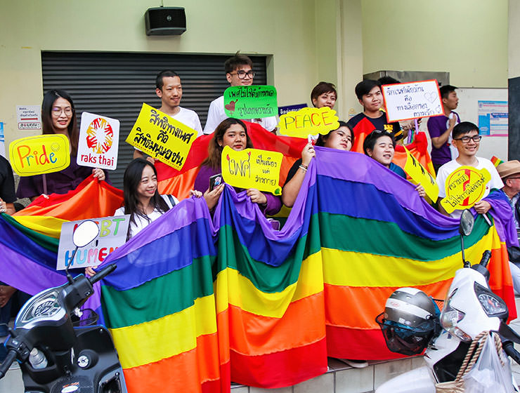 Participants posing with big rainbow flag at Chiang Mai Pride, gay parade in Chiang Mai, Thailand, photo by Ivan Kralj