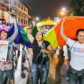 Participants shouting while walking with a huge rainbow flag at Chiang Mai Pride, gay parade in Chiang Mai, Thailand, photo by Ivan Kralj