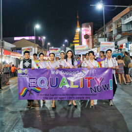 Participants with placard "we support equality" walking at Chiang Mai Pride, gay parade in Chiang Mai, Thailand, photo by Ivan Kralj