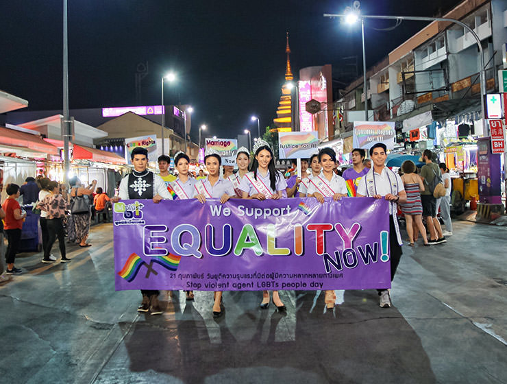Participants with placard "we support equality" walking at Chiang Mai Pride, gay parade in Chiang Mai, Thailand, photo by Ivan Kralj