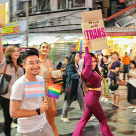 Participants with placard "proud to be trans" walking at Chiang Mai Pride, gay parade in Chiang Mai, Thailand, photo by Ivan Kralj