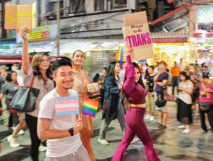 Participants with placard "proud to be trans" walking at Chiang Mai Pride, gay parade in Chiang Mai, Thailand, photo by Ivan Kralj