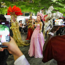Passers-by photographing the ladyboy participants at Chiang Mai Pride, gay parade in Chiang Mai, Thailand, photo by Ivan Kralj