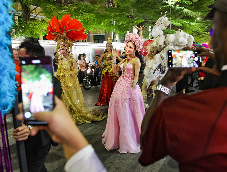 Passers-by photographing the ladyboy participants at Chiang Mai Pride, gay parade in Chiang Mai, Thailand, photo by Ivan Kralj