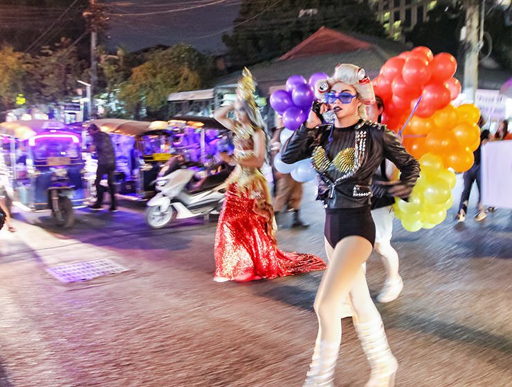 Lady Gaga impersonator with a telephone, crossing the road at Chiang Mai Pride, gay parade in Chiang Mai, Thailand, photo by Ivan Kralj