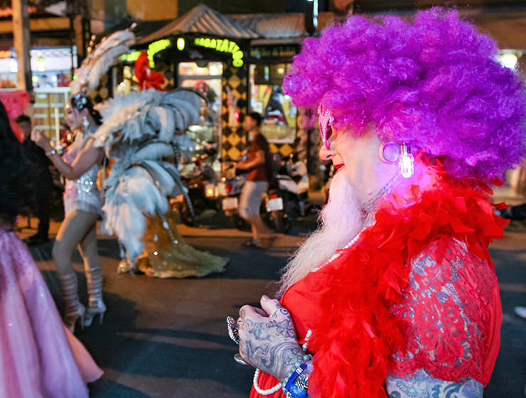 Bearded participant in a dress and purple wig at Chiang Mai Pride, gay parade in Chiang Mai, Thailand, photo by Ivan Kralj