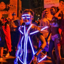 Participant in lighted costume posing at Chiang Mai Pride, gay parade in Chiang Mai, Thailand, photo by Ivan Kralj