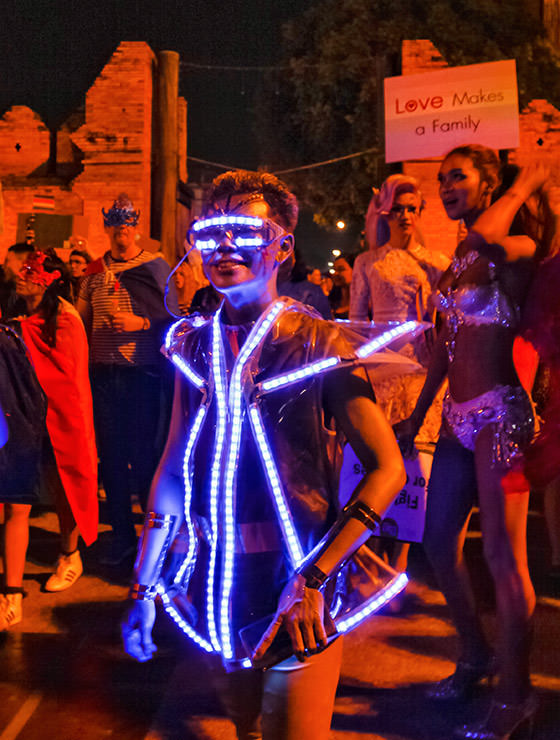 Participant in lighted costume posing at Chiang Mai Pride, gay parade in Chiang Mai, Thailand, photo by Ivan Kralj