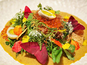 Luang Prabang salad with Asian watercress, salted quails egg, cured fish eggs, and crispy sea kelp, served at The Paste Restaurant, after the recipe of a Michelin-starred chef Bee Satongun; eating at The Paste is considered to be one of the best things to do in Luang Prabang, Laos, photo by Ivan Kralj