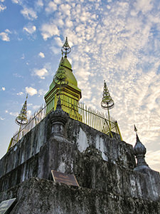 The gilded stupa of Wat Chom Si on the summit of Mount Phou Si, climbing the hill is considered to be one of the best things to do in Luang Prabang, Laos, photo by Ivan Kralj