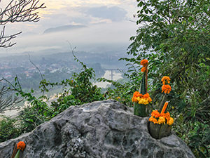 Buddhist offering in the foreground of a view from the Phou Si Mountain top, supposedly one of the best places to watch sunrise and sunset in Luang Prabang, Laos, photo by Ivan Kralj