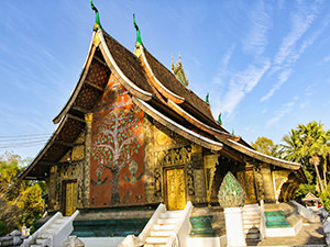 The tree of life painted on the back wall of Wat Xieng Thong's sim; visiting this temple is considered to be one of the best things to do in Luang Prabang, photo by Ivan Kralj