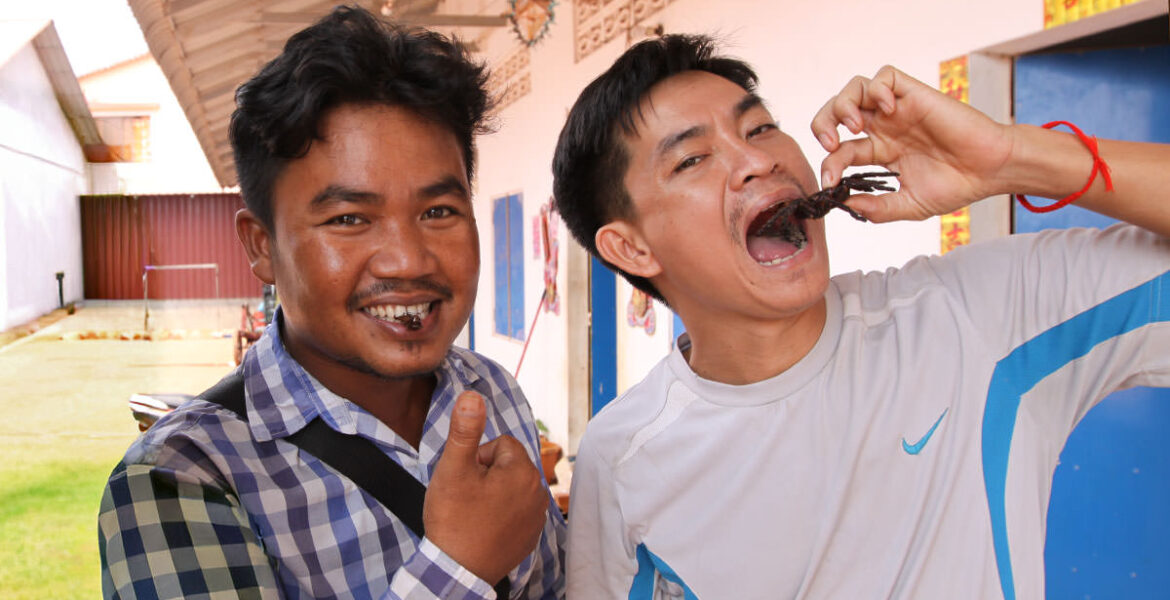 Cambodians eating a cricket and a scorpion at Fear Factor Challenge, a Backstreet Academy cooking class in Siem Reap, Cambodia, the country where people love eating insect food, photo by Ivan Kralj.